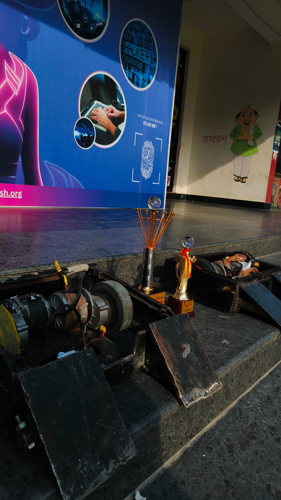 Two combat robots facing off in an arena